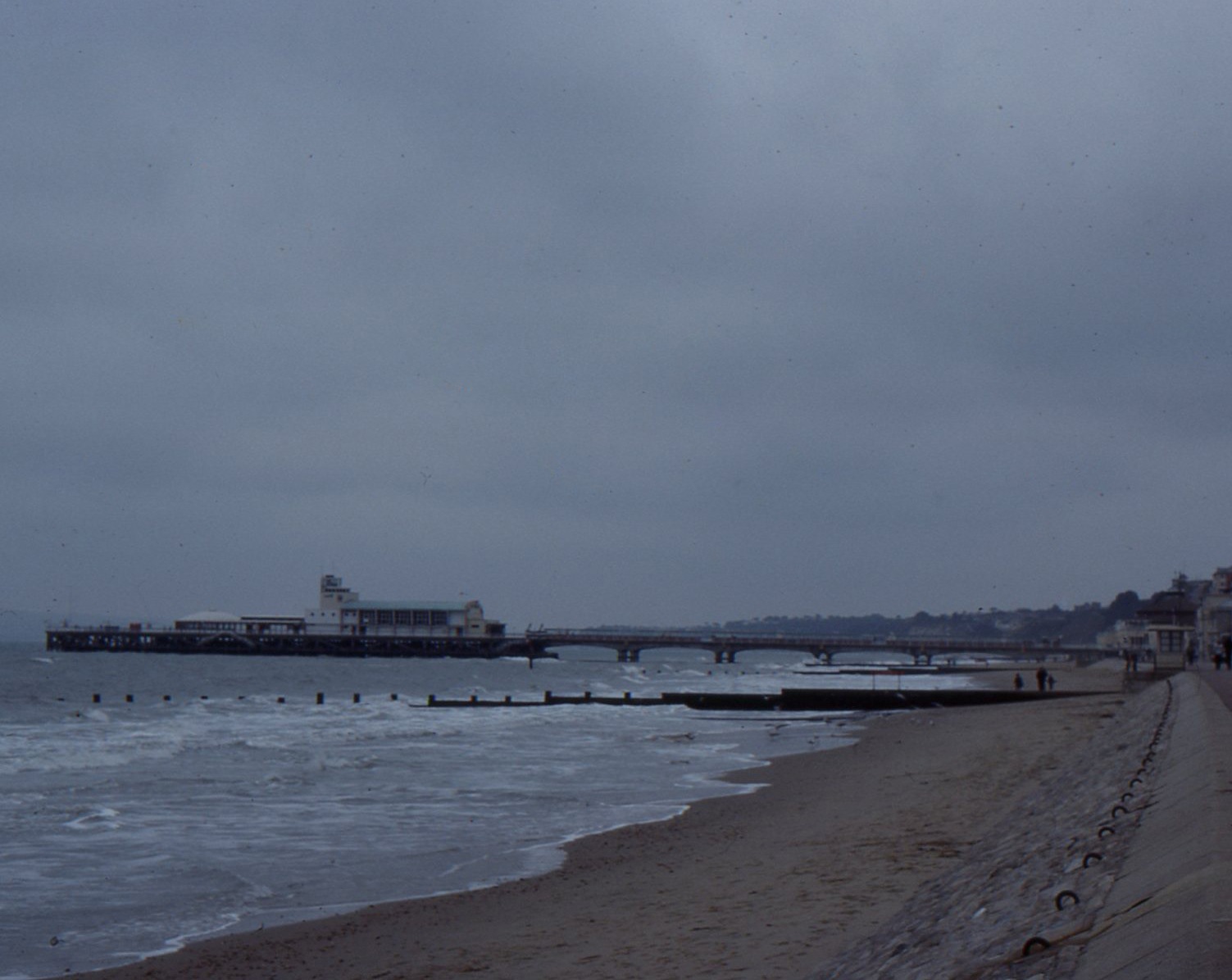Families on the sandy beach by Bournemouth Pier
